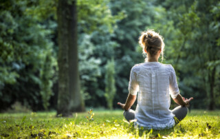 woman meditating outside
